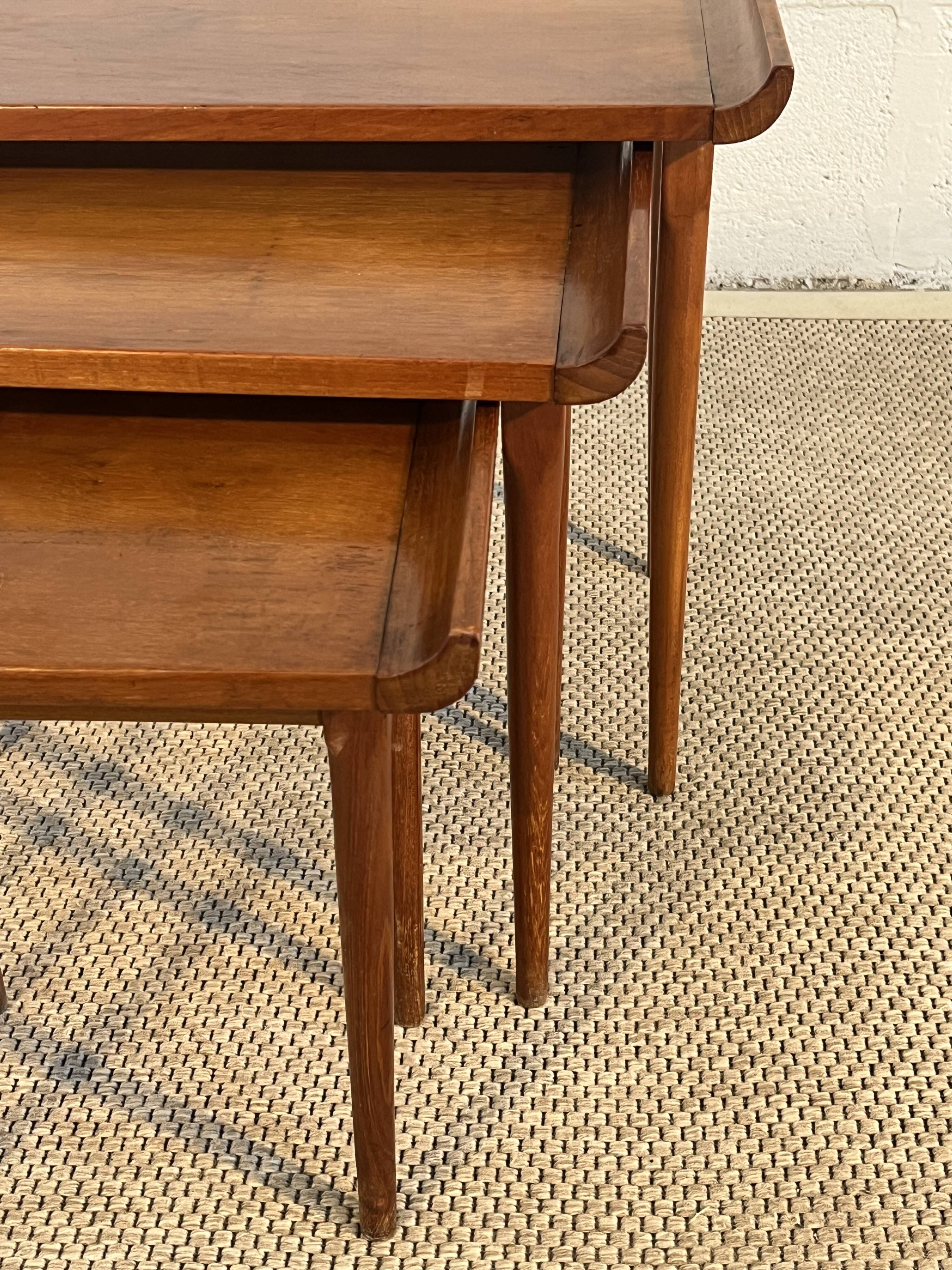 Set of three nesting low tables in a Japanese style, made of mahogany.