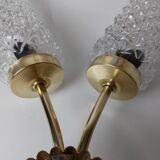 Gold wall light with diamond tips