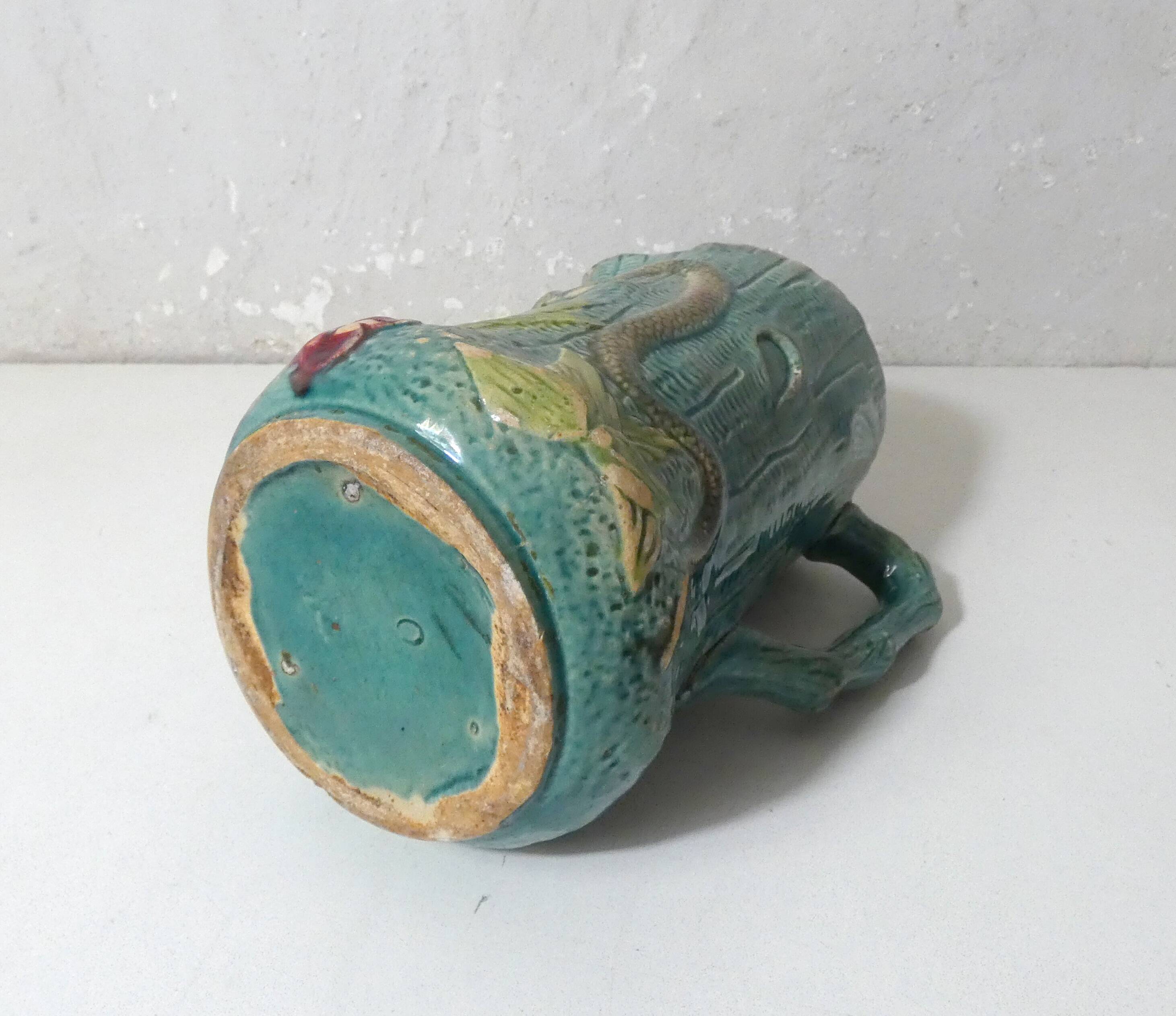 Antique turquoise Art Deco majolica pitcher vase with a snake motif
