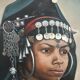 Portrait of a young Moroccan woman in traditional attire and adornments.