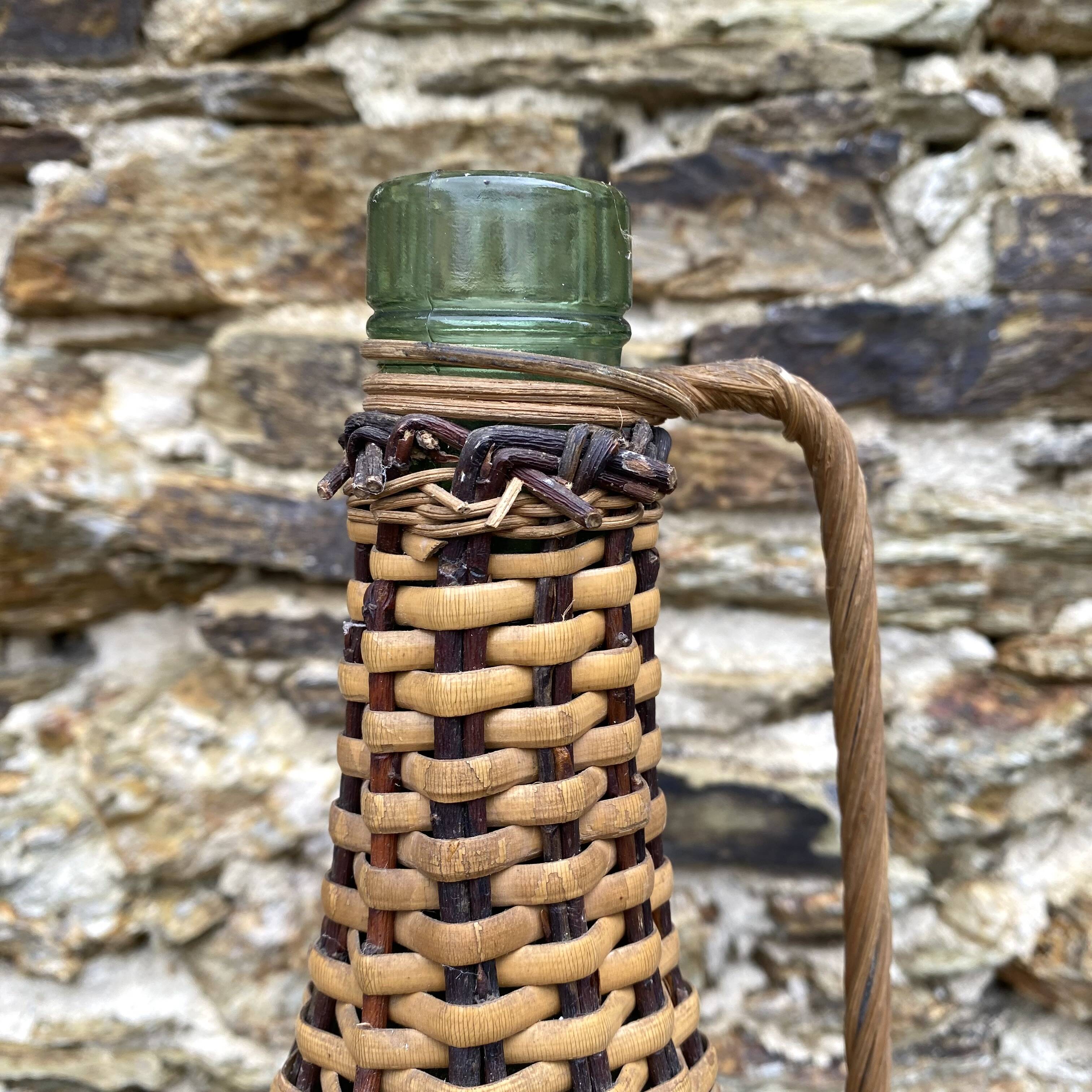 Glass bottles and rattan, woven wicker