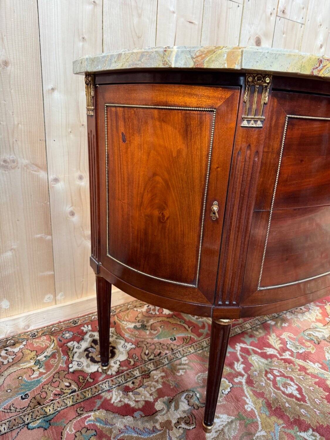 Louis XVI half-moon commode in mahogany and marble