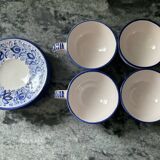 Set of 4 white/blue ceramic cups and saucers.
