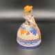 Trio of ceramic bell figurines
