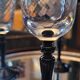 4 clear glass flutes with black stems. 1960–1970. 4 clear glass flutes with black stems.