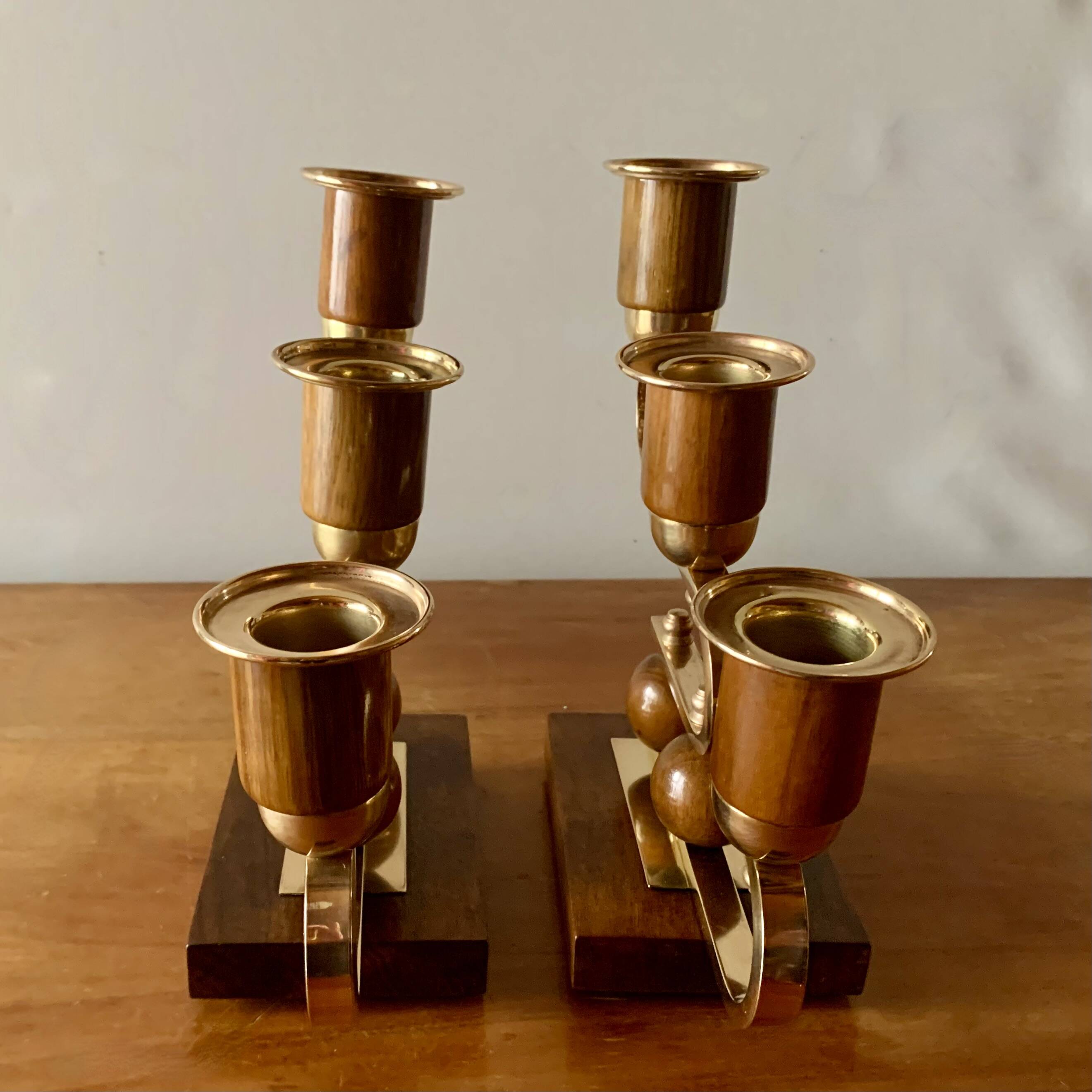 Pair of Art Deco candlesticks in gilded brass and wood