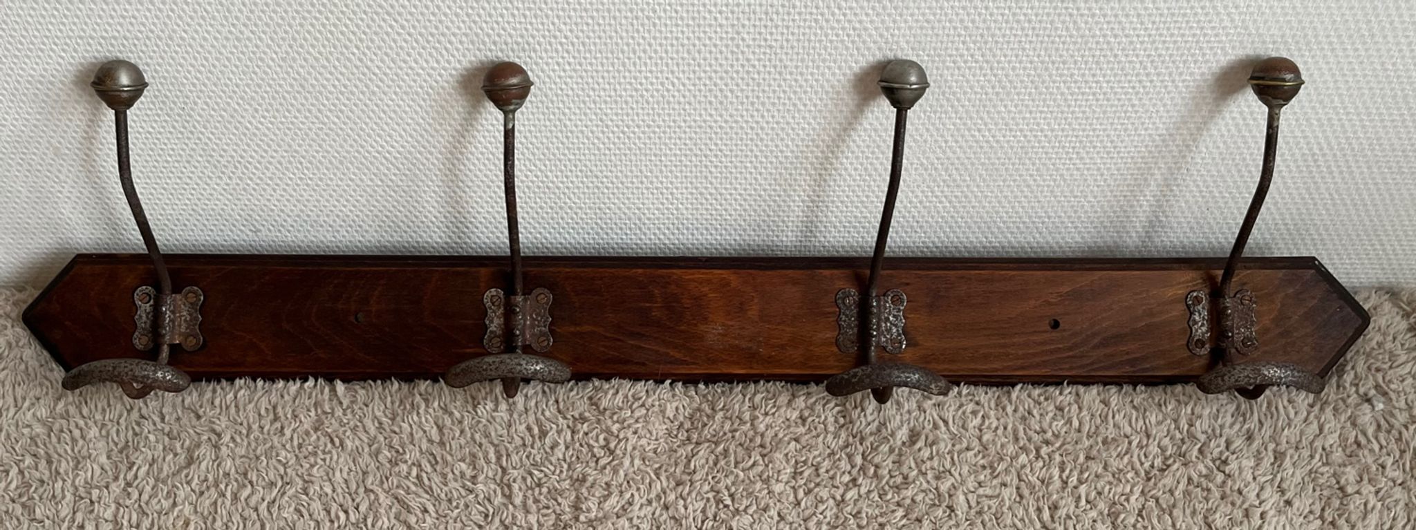 Old coat rack with metal/brass hooks