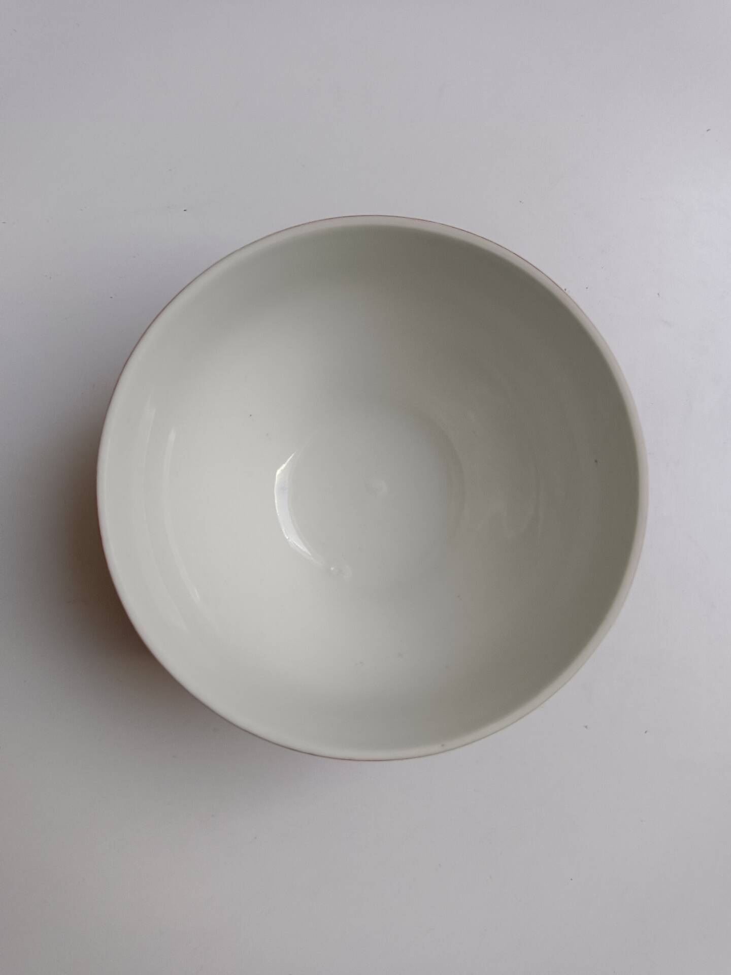 Red bowl with white polka dots in Longchamp ceramic