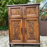 Low carved wooden sideboard