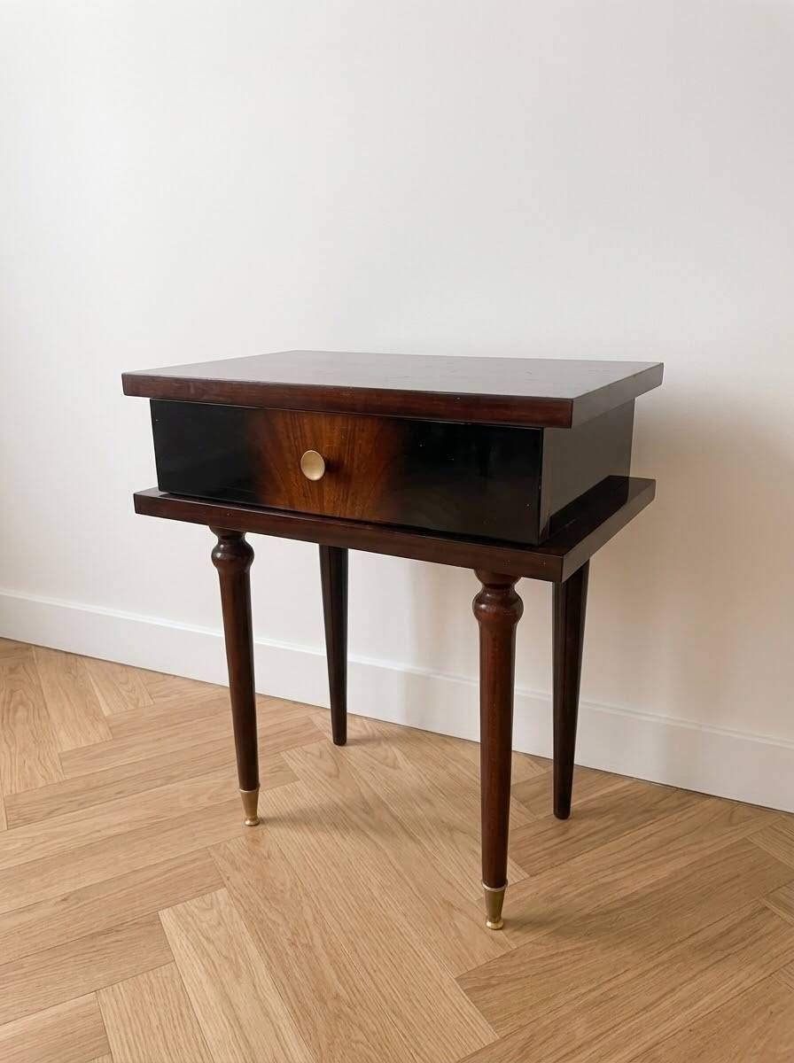 Vintage Art Deco bedside table in dark wood with gold details.