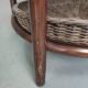 Vintage rattan coffee table with smoked glass top and rattan basket shelf