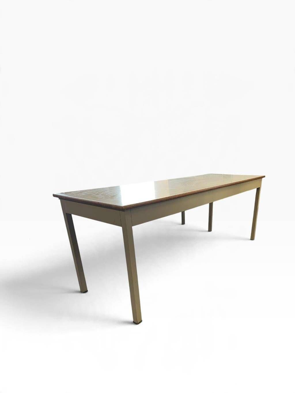 Vintage industrial table with a Formica top and wooden accents.