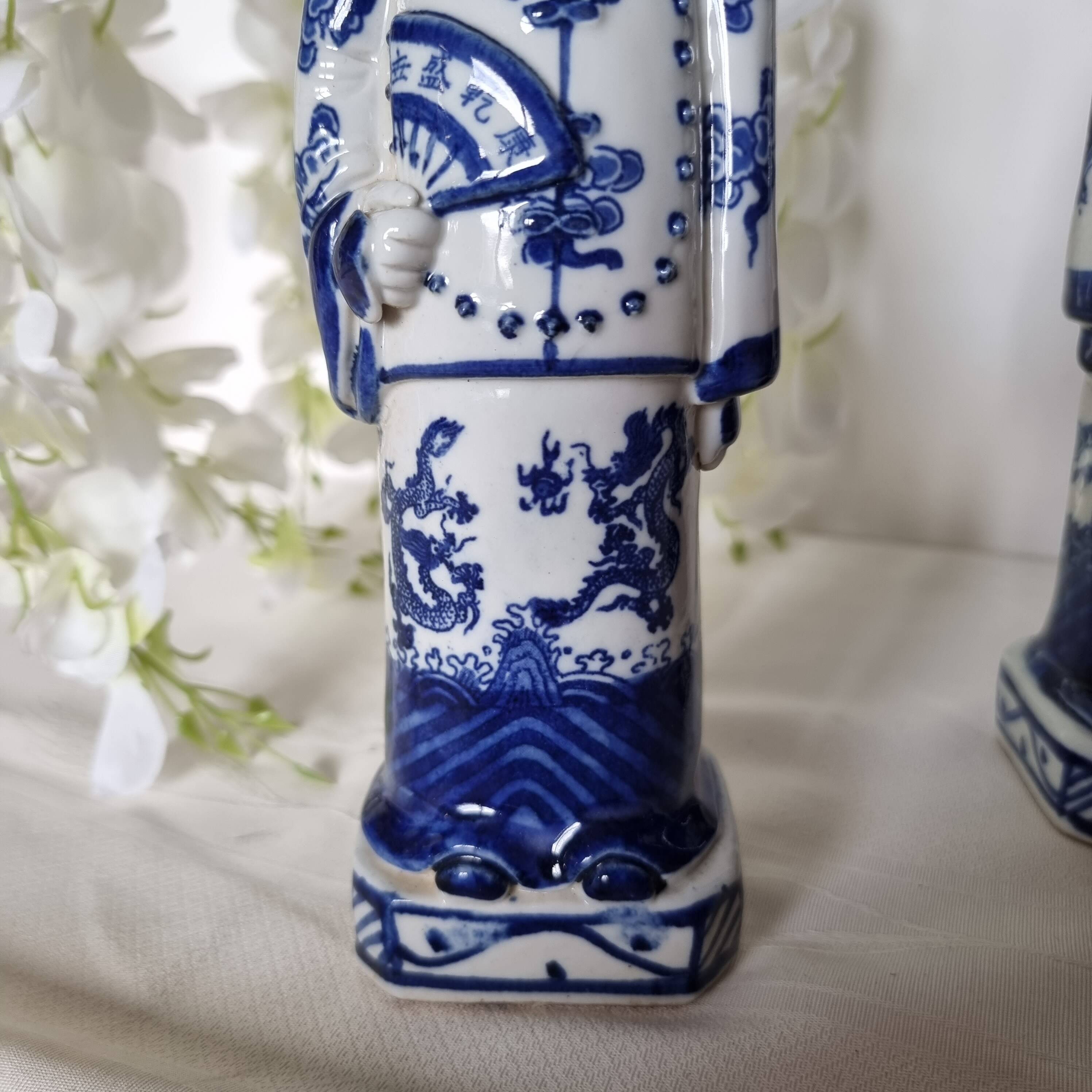 Pair of vintage Chinese blue and white porcelain figurines depicting