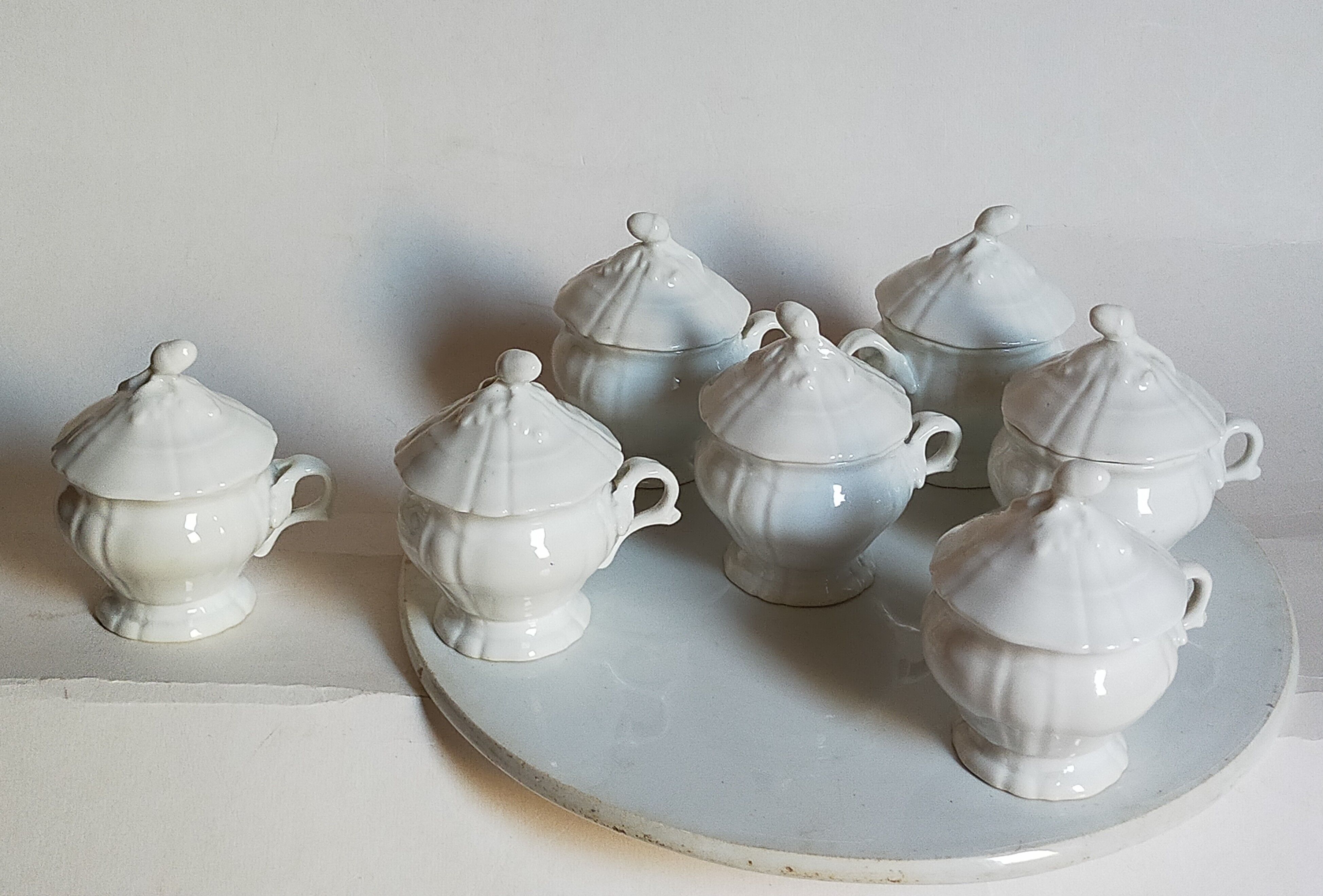 Set of seven covered pots and tray old white slurry nineteenth