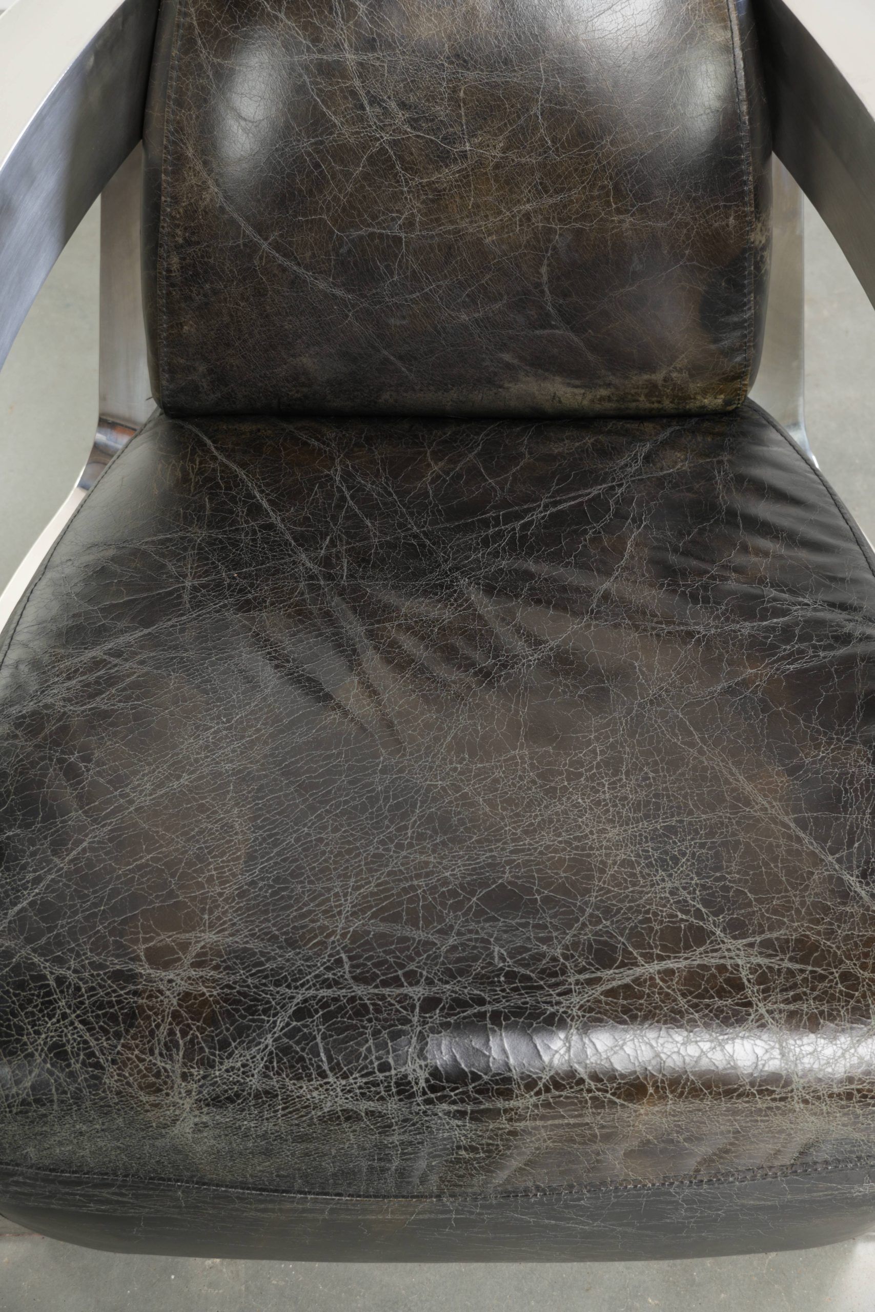 Industrial Aviator design armchair in cowhide finished with aluminium