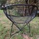 Pair of round chairs in black tubular steel 1960
