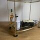 Vintage rolling service in gilded metal and smoked glass