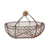 Basket has former apples in metal and wire mesh