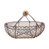 Basket has former apples in metal and wire mesh