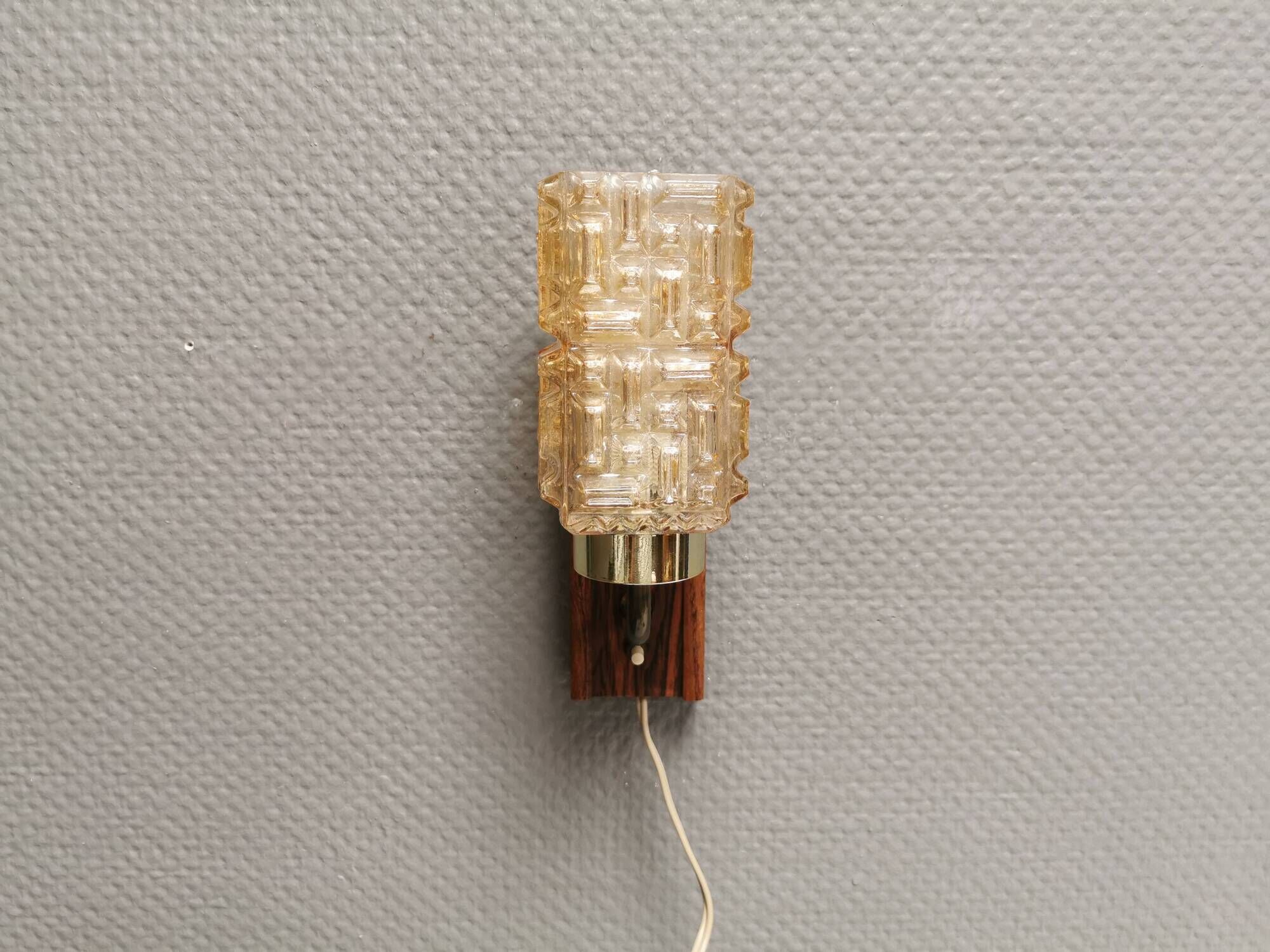 Small, stylish wall lamp with rosewood suspension and hard pressed glass