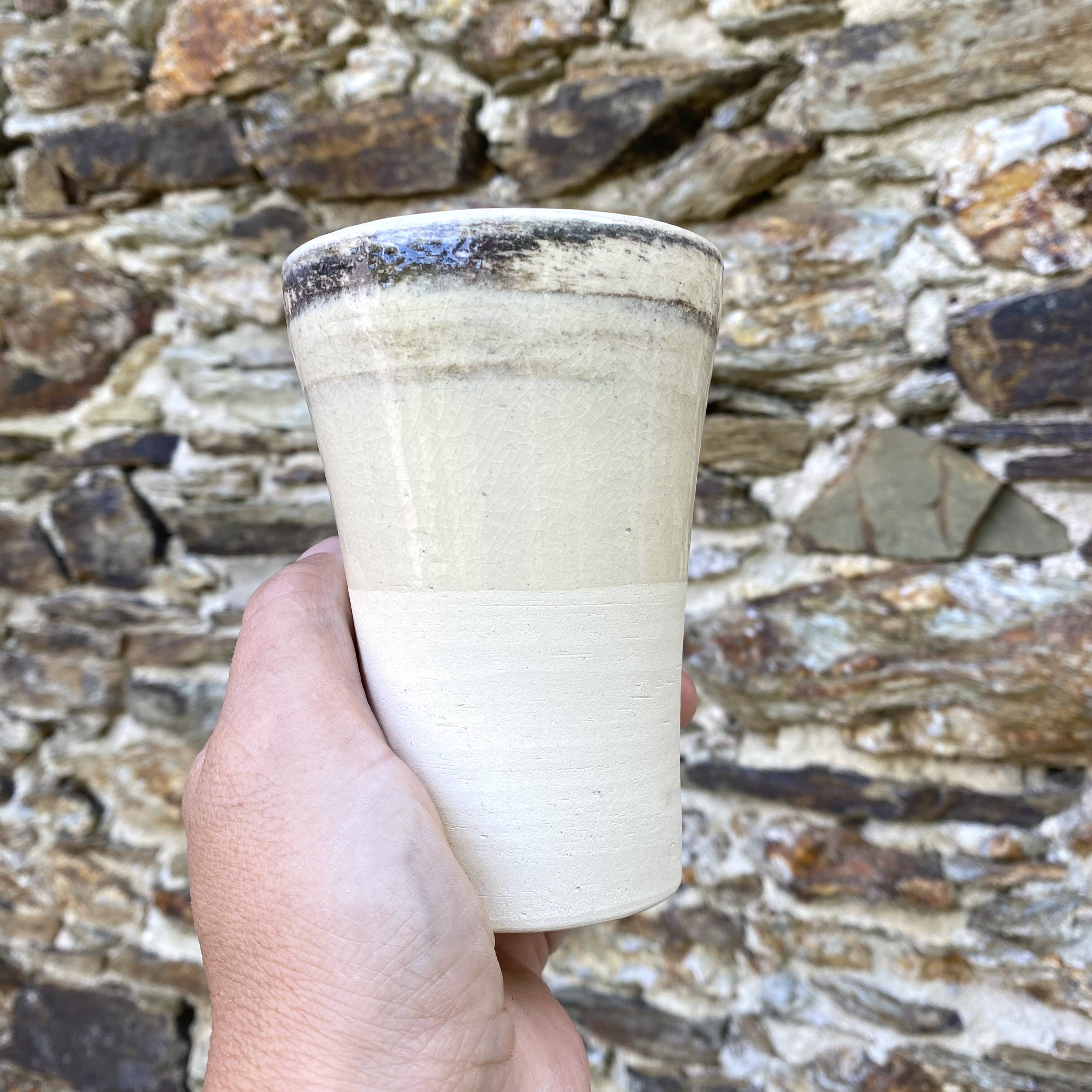 High ceramic cups made of mixed clay.