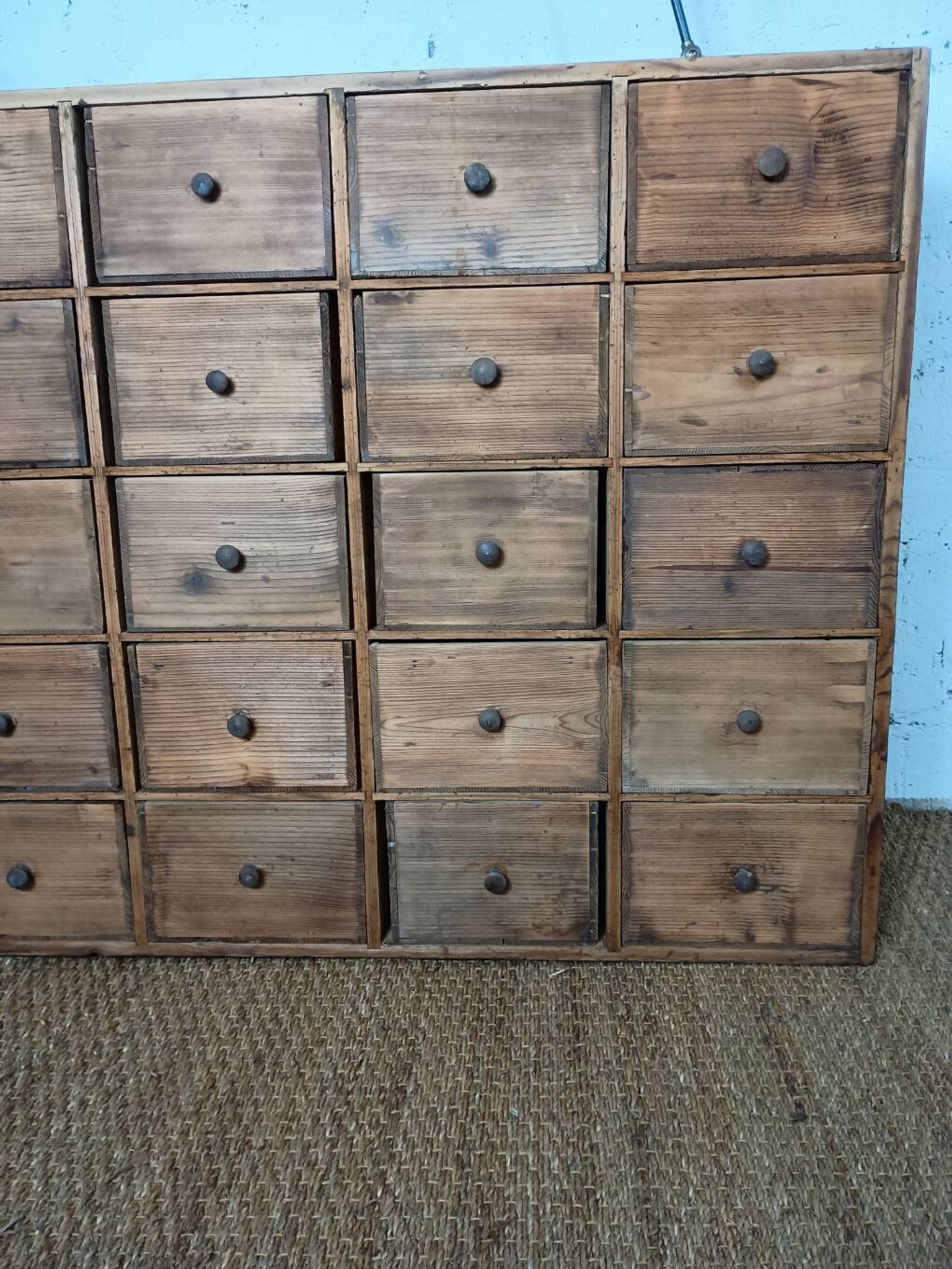 Industrial or apothecary workbench with 30 vintage wooden drawers.
