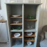 Vintage furniture transformed into a bookcase, verdigris patinated sideboard.