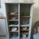 Vintage furniture transformed into a bookcase, verdigris patinated sideboard.