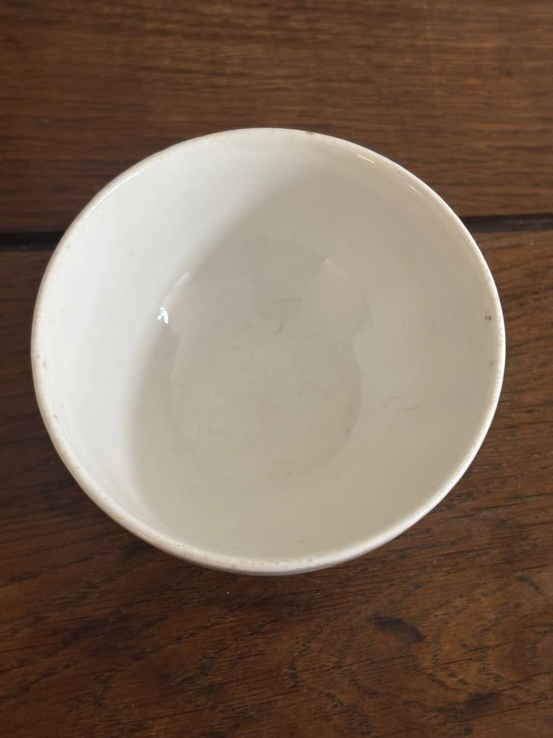 Vintage small antique bowl with floral decoration.