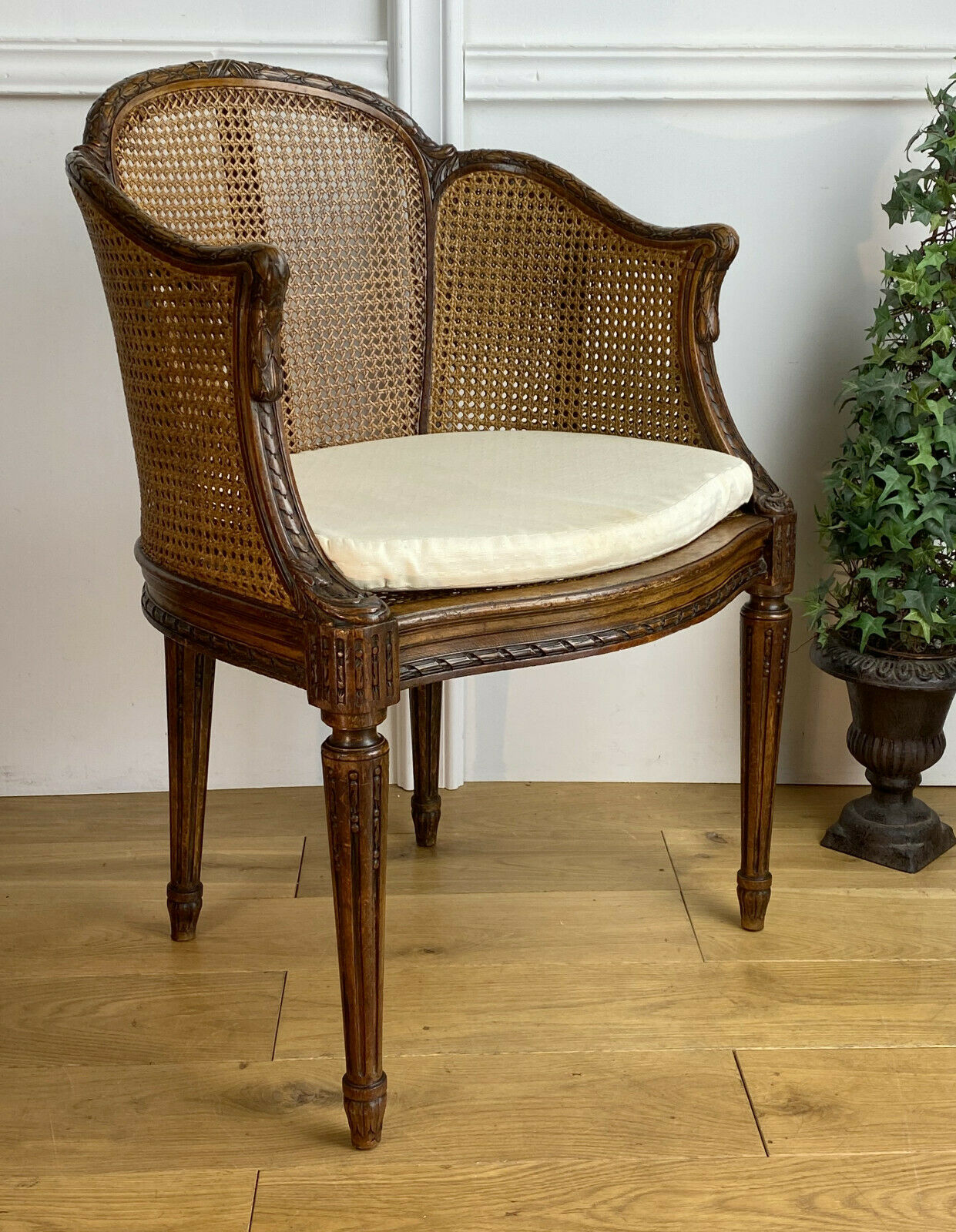 Old armchair with double cannage in walnut carved style Louis XVI of the nineteenth century