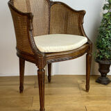Old armchair with double cannage in walnut carved style Louis XVI of the nineteenth century