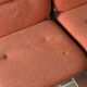 Strafor 3-seater bench, orange upholstery and sled base, 1970s.
