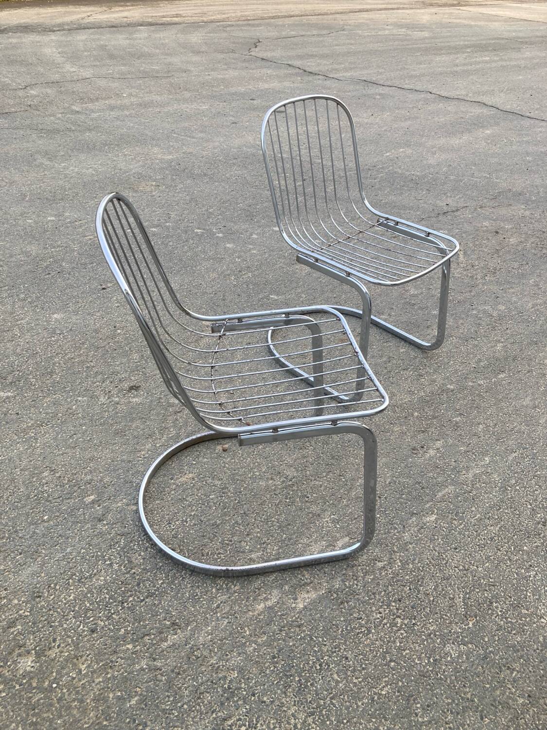 Two Gastone Rinaldi style chrome metal chairs.