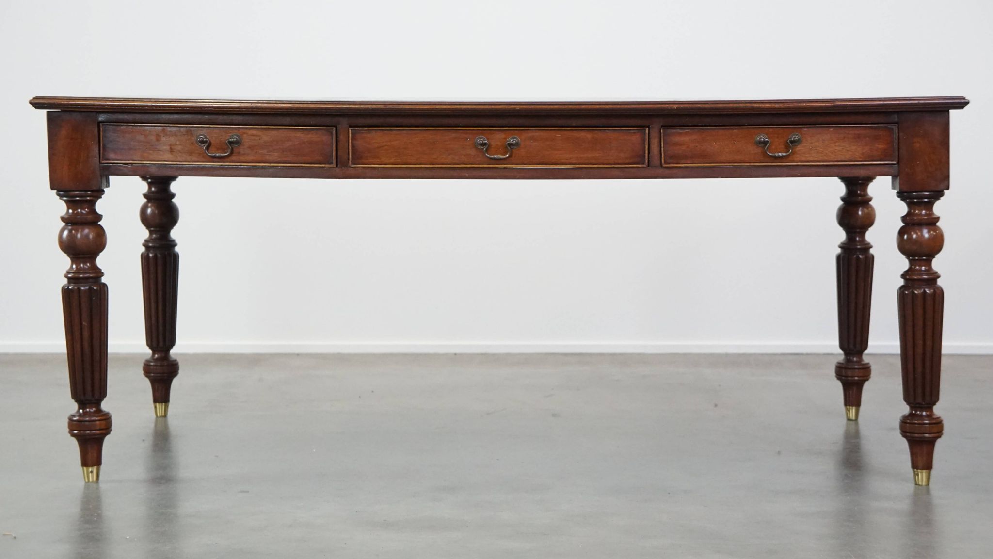 Large writing desk with green leather top, elegant legs and 3 English style drawers