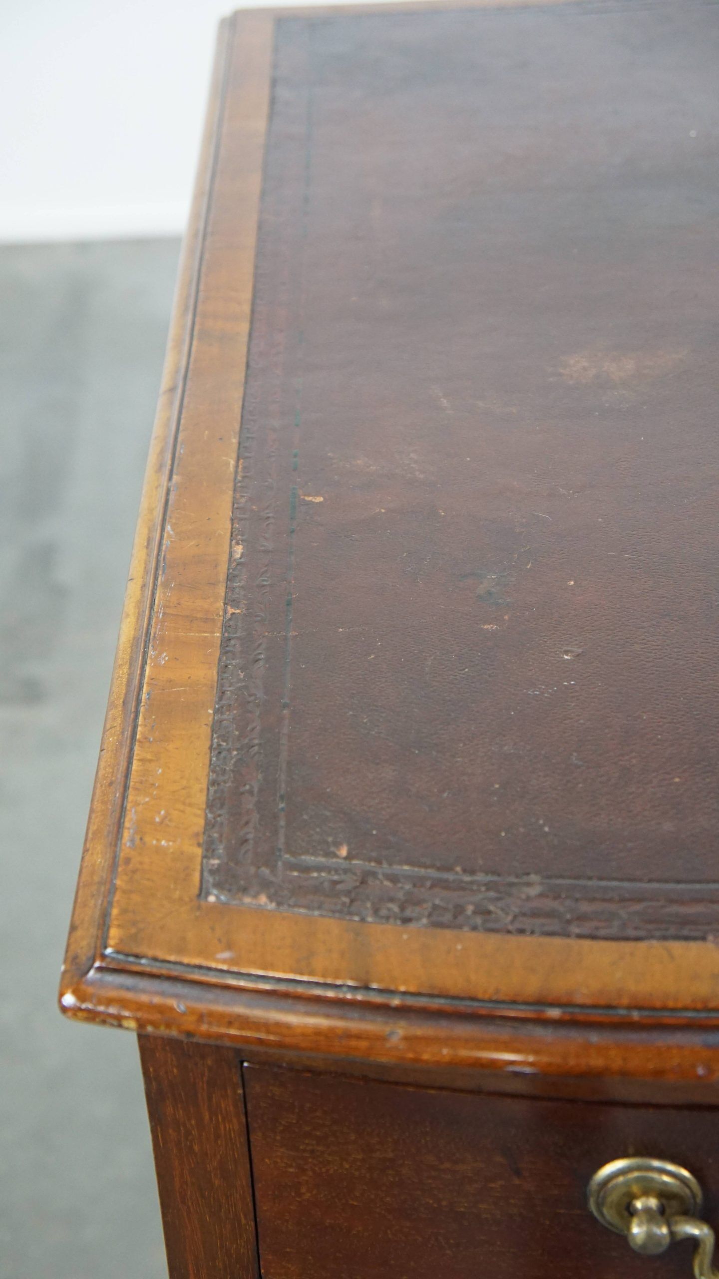 Antique English wooden desk from the late 19th century with a leather top