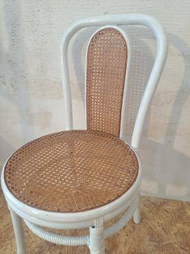 4 white rattan and cane chairs