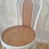4 white rattan and cane chairs