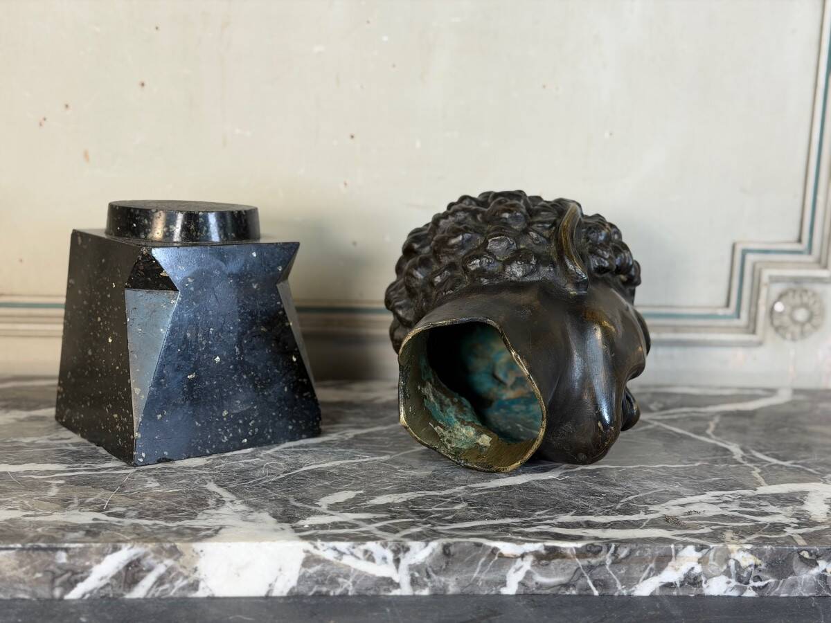 Head of a faun smiling, bronze after the antique, 19th century.