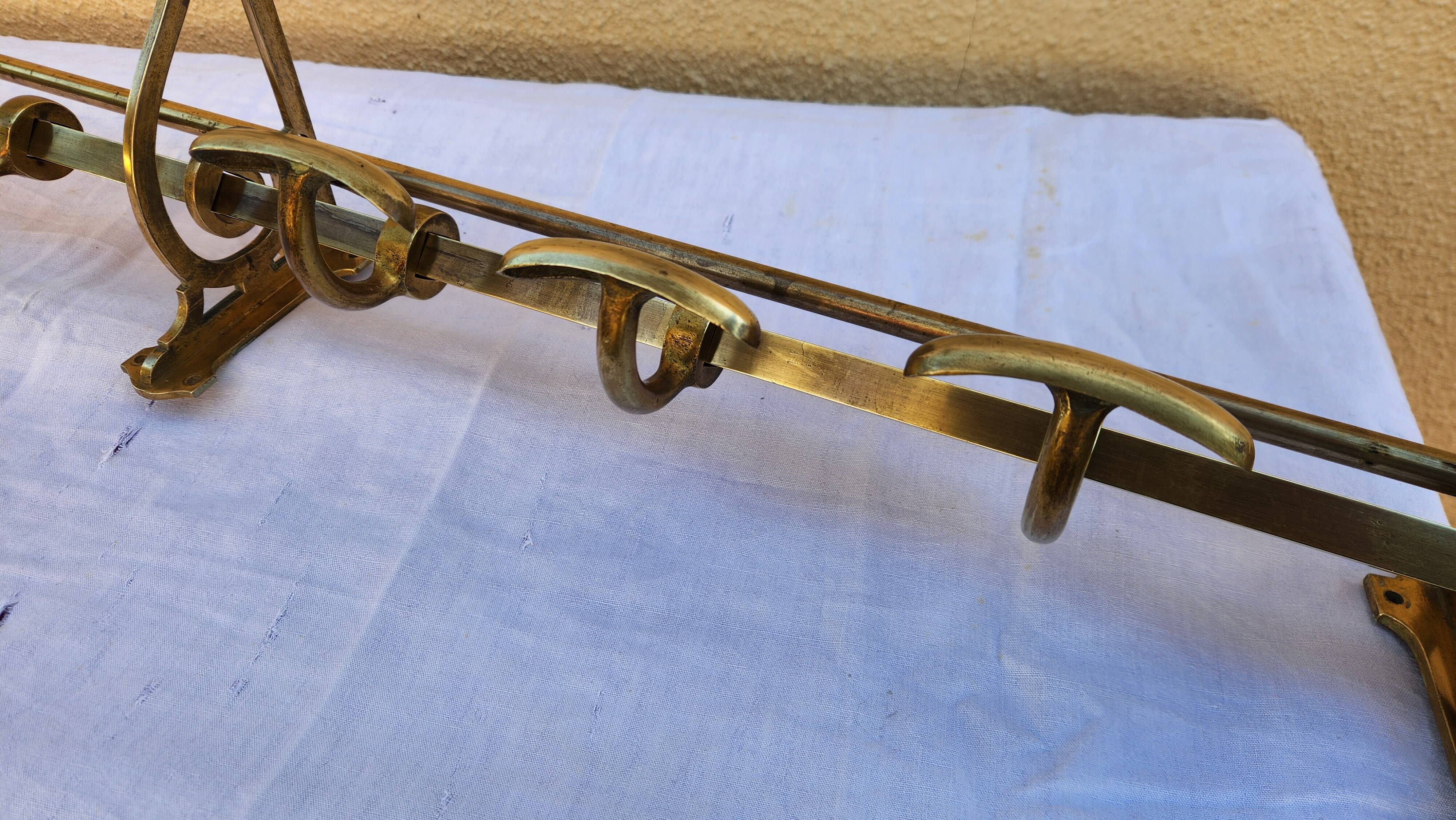 very beautiful wall-mounted coat rack wardrobe in brass from the 19th century