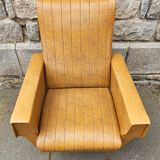 Pair of mustard skaï armchairs, brass feet
