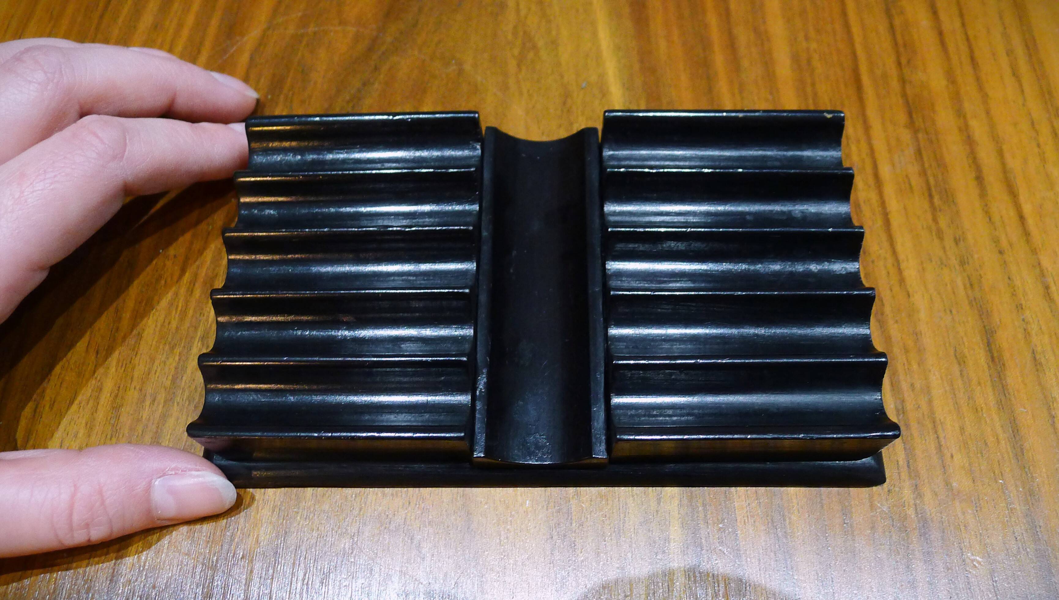 Old pen holder in black wood