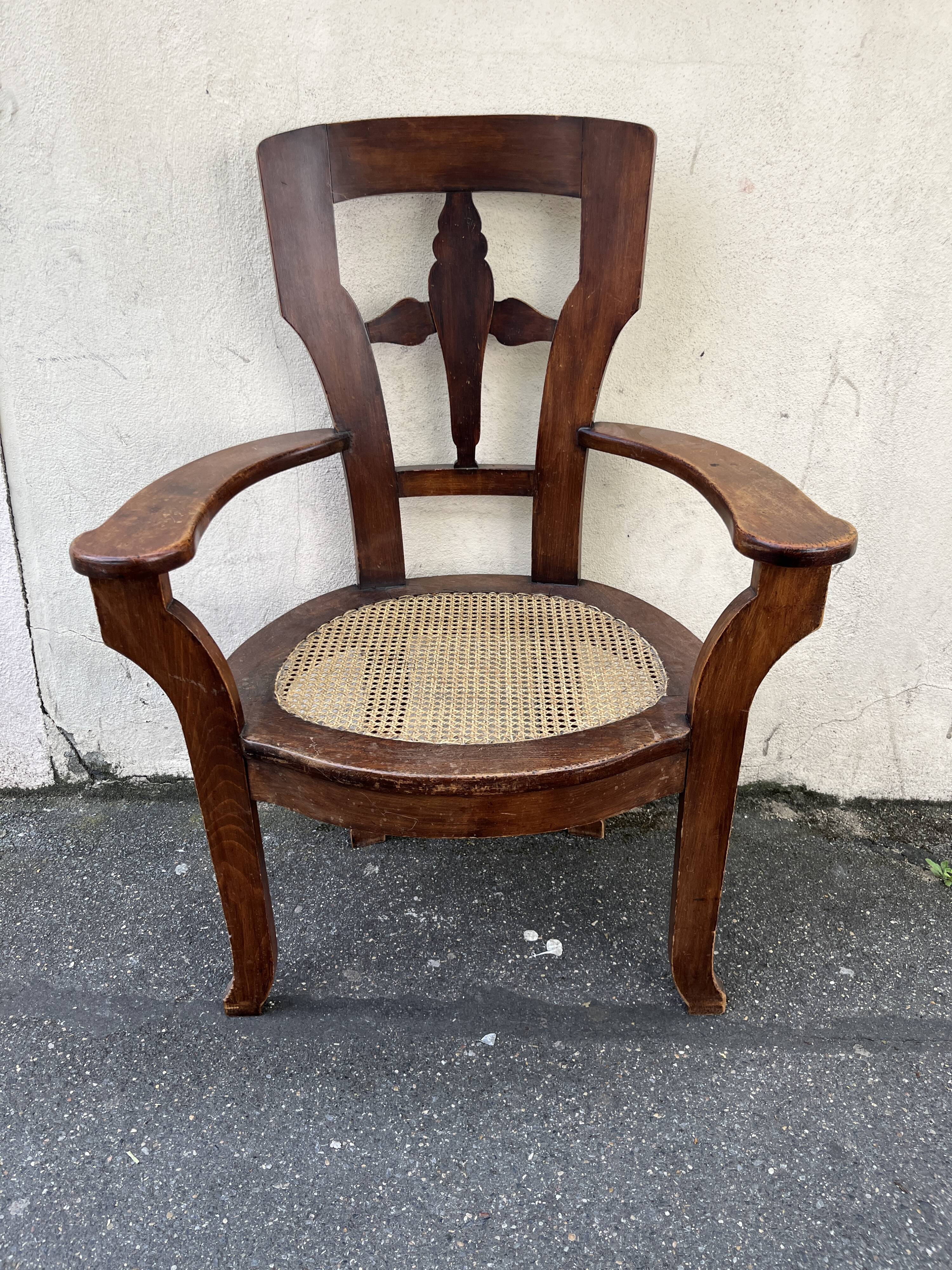 Large caned armchair