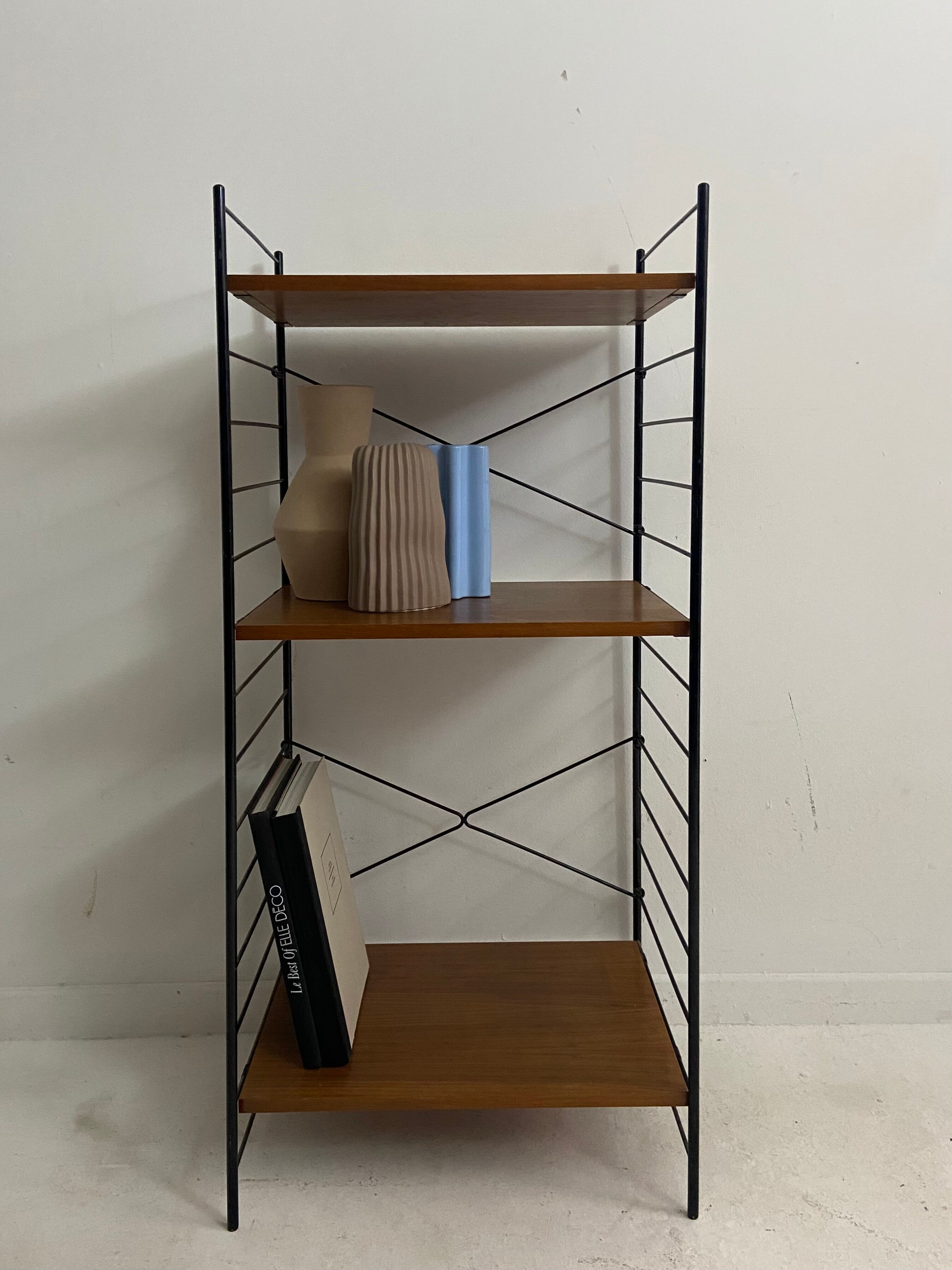small vintage metal and teak string bookshelf