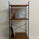 small vintage metal and teak string bookshelf