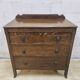 Antique chest of drawers on wheels with wood carving (key top drawer)