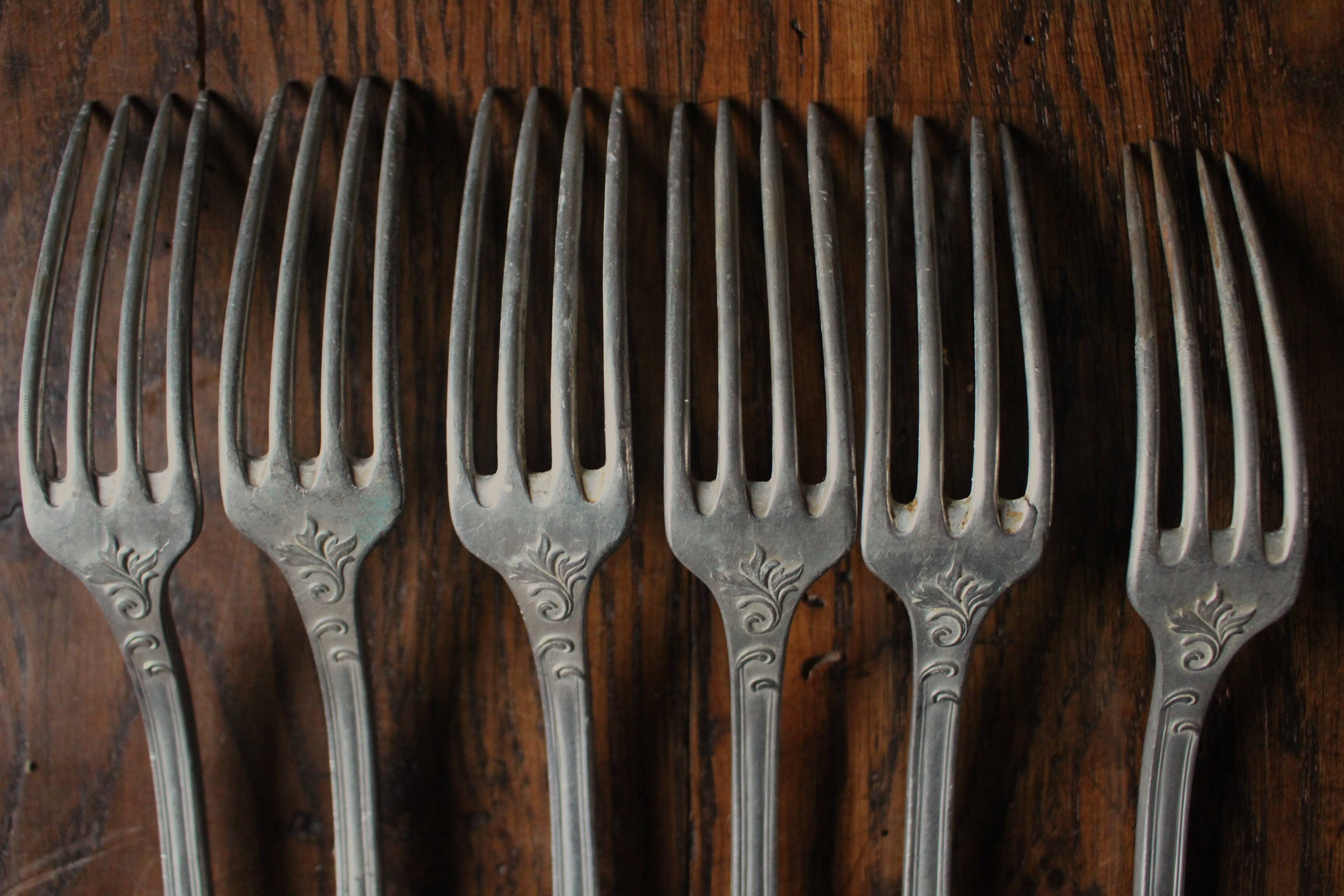 A set of 6 old flowered metal forks