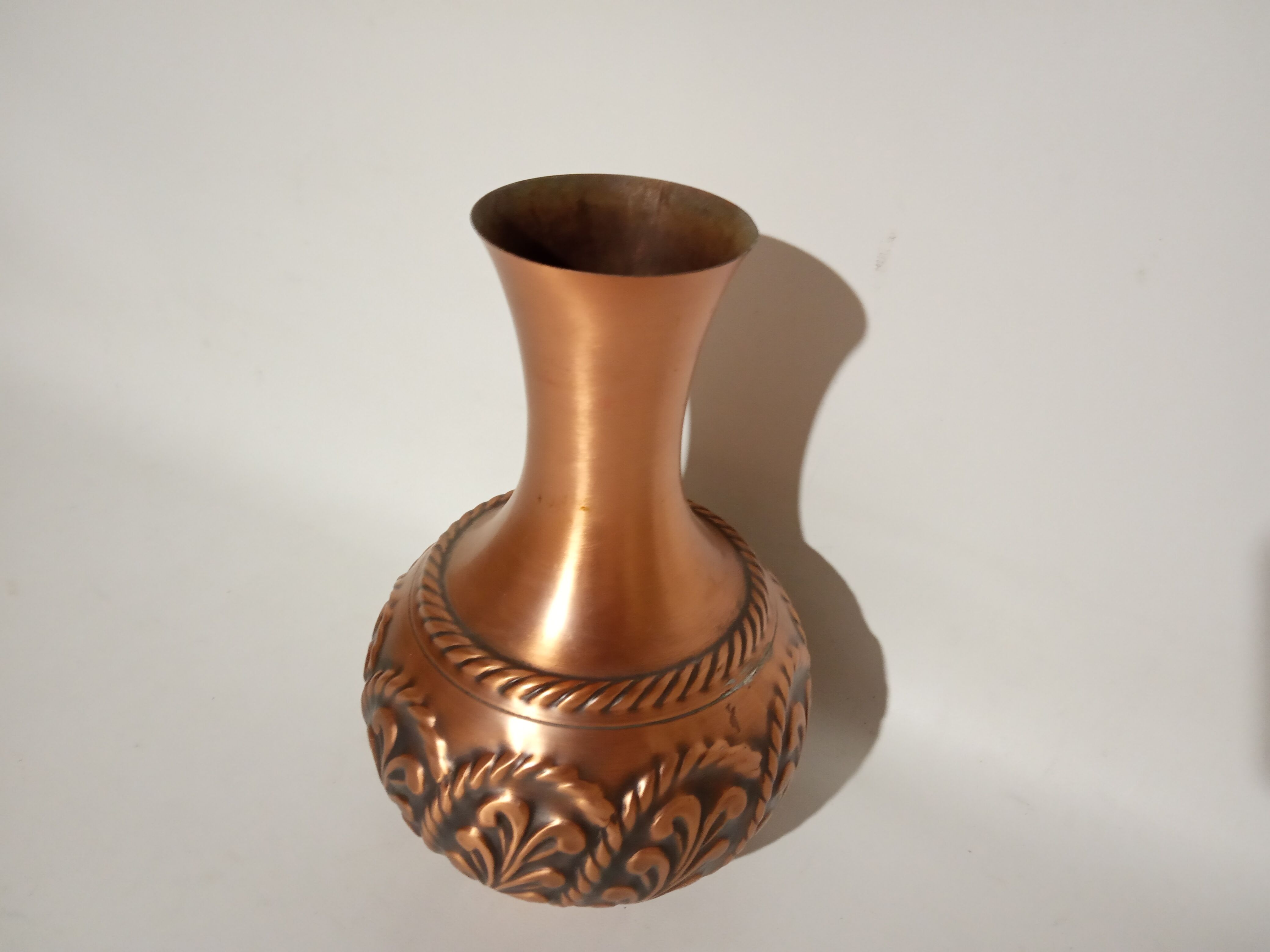 Sculpted copper vase