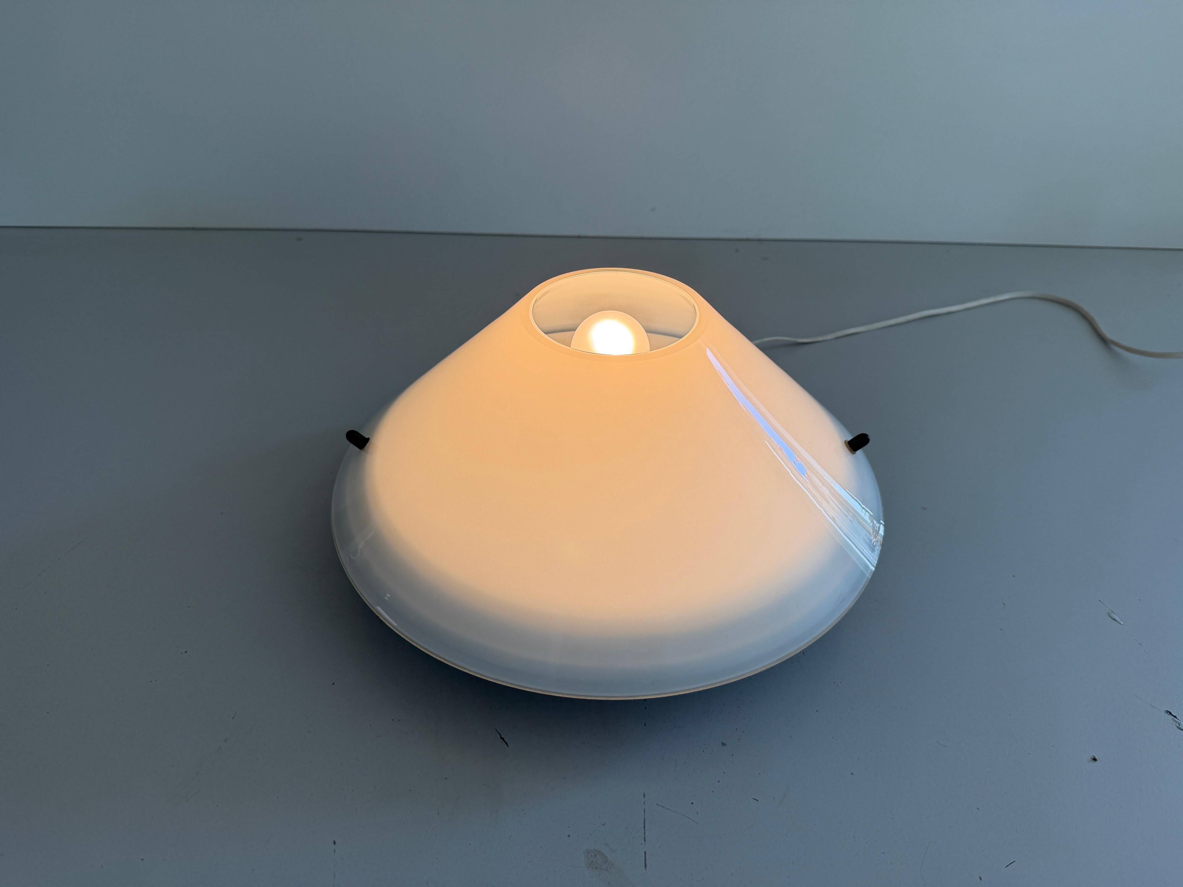 Simple opal glass wall light from the mid-century by Lamperti, 1960s, Italy.