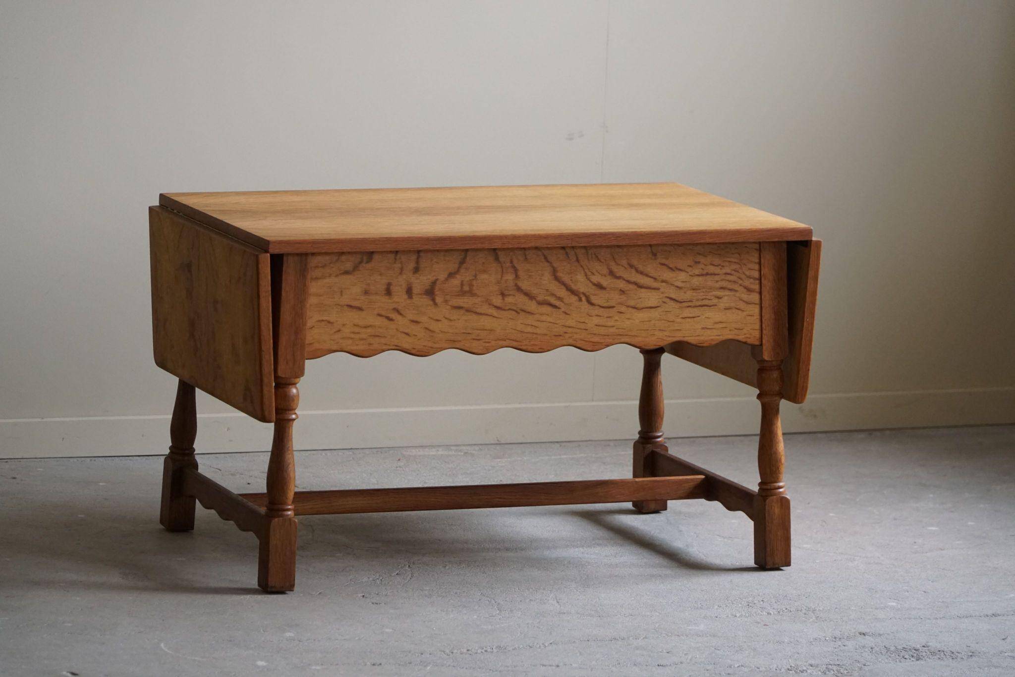 Danish folding table from the mid-century with a drawer in oak, Henning Kjærnulf, 1960s.
