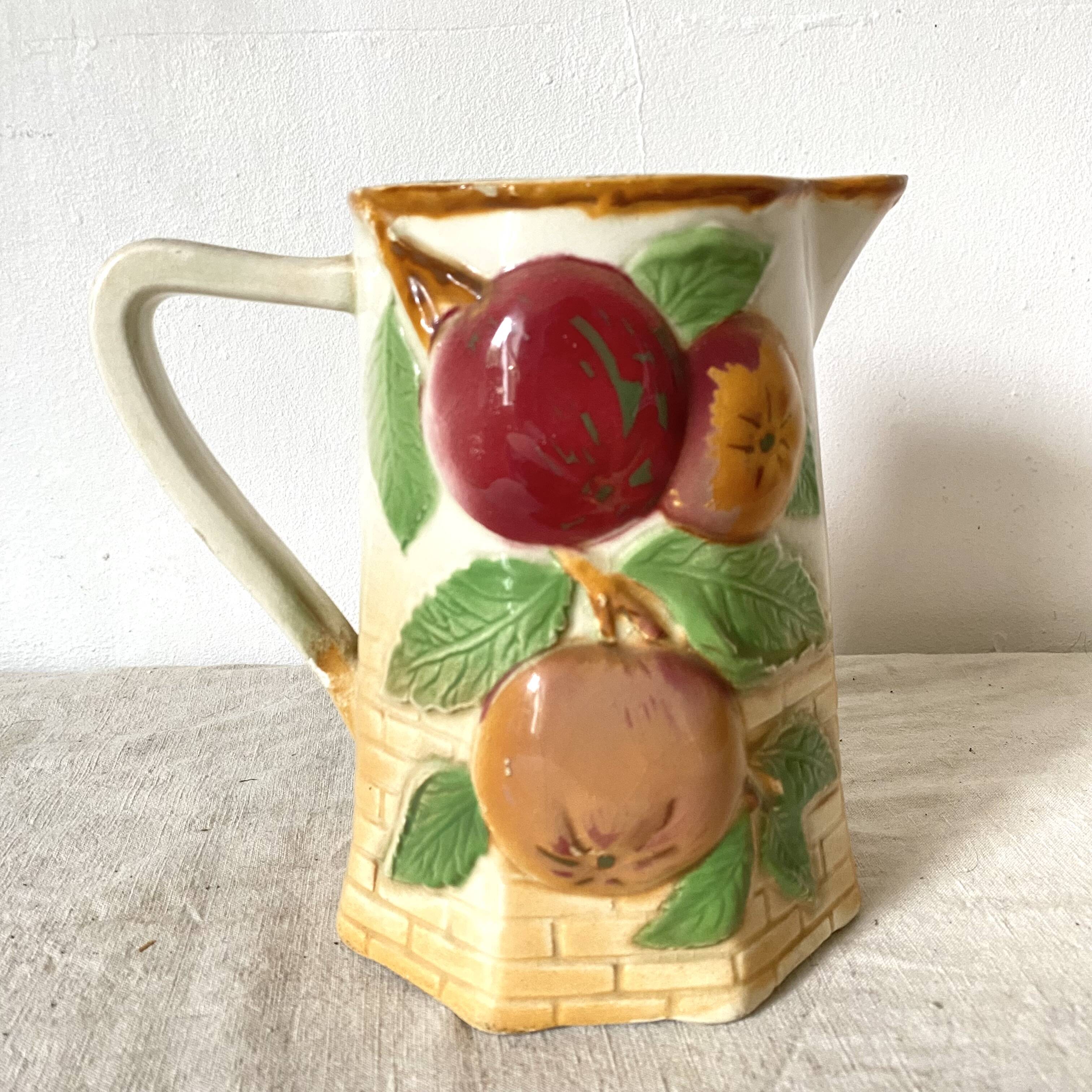 Antique pitcher in Apple slip